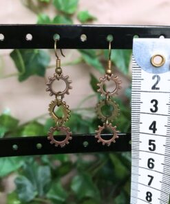 Alternative view of Kobber øreringe med 3 tandhjul